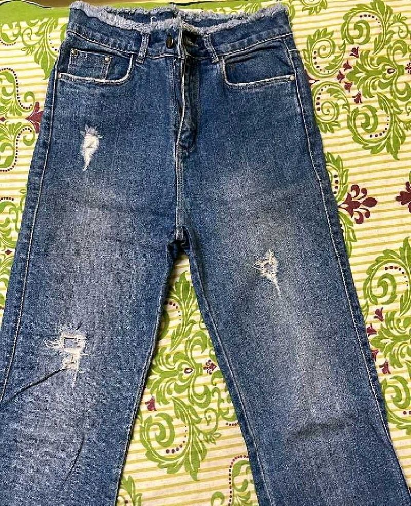 Distressed Blue Denim Jeans