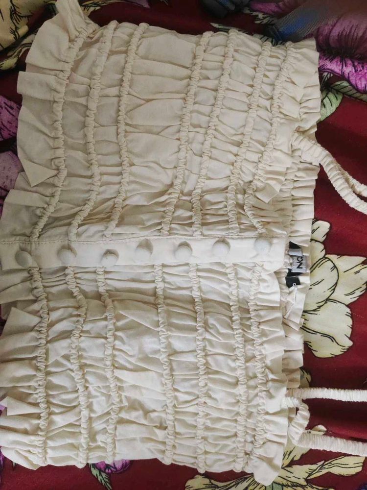 Smocked Cream Top with Ruffle Detail