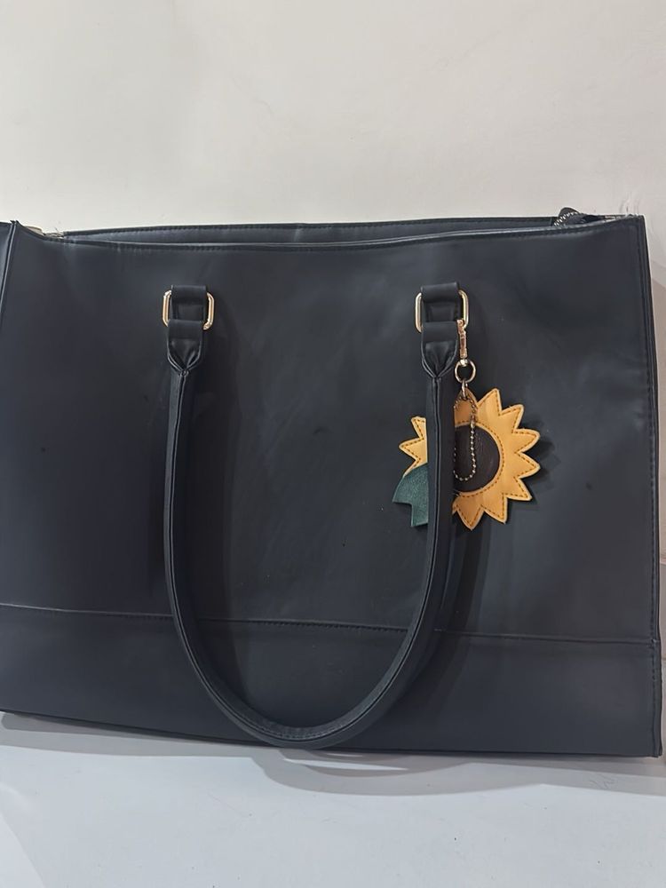 Chic Black Tote Bag with Sunflower Charm