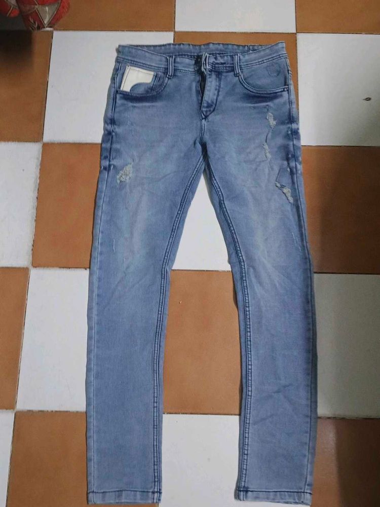 Light Wash Distressed Denim Jeans