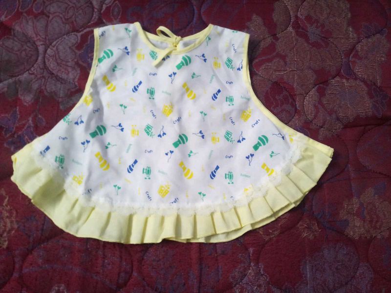 Cute Baby Girl's White Bib with Yellow Trim