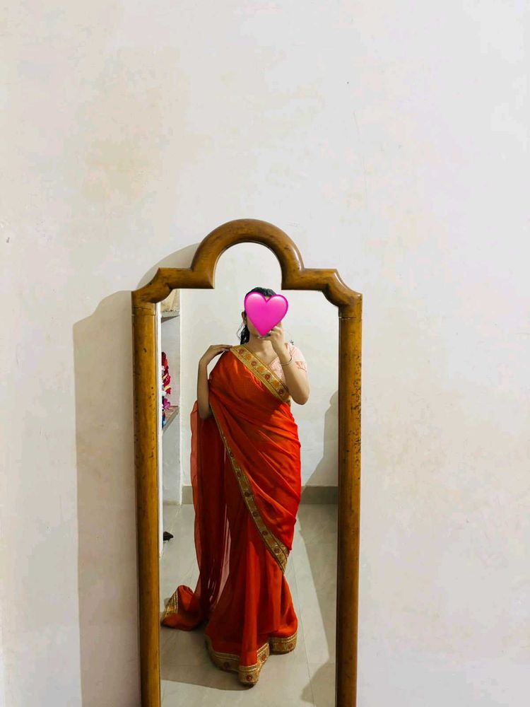 Vibrant Orange Saree with Golden Border