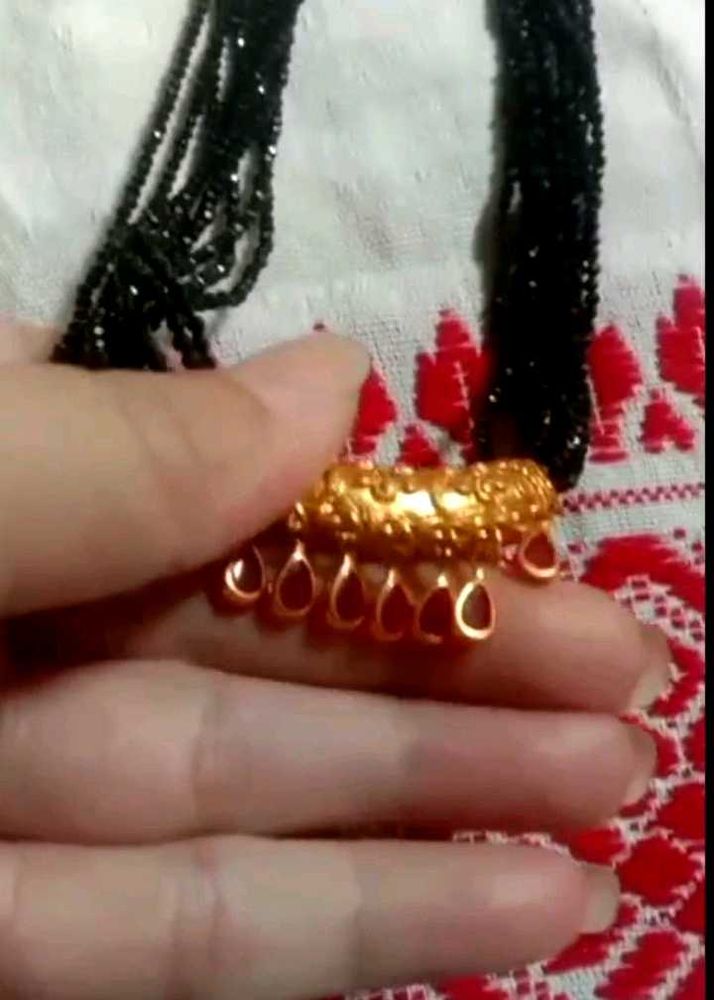 Elegant Black Beaded Necklace with Gold Pendant