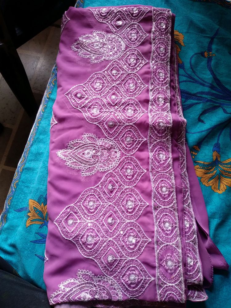 Georgette saree eith blouse..border and design...Pink in colour..
