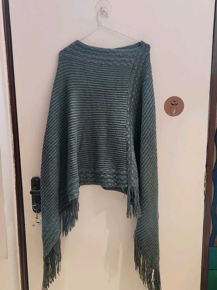 Stylish Knitted Poncho with Fringes