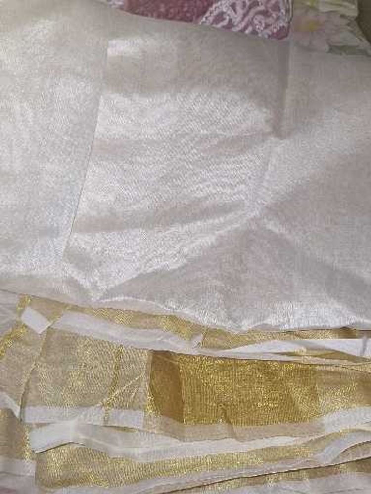 Elegant White and Gold Saree Onam