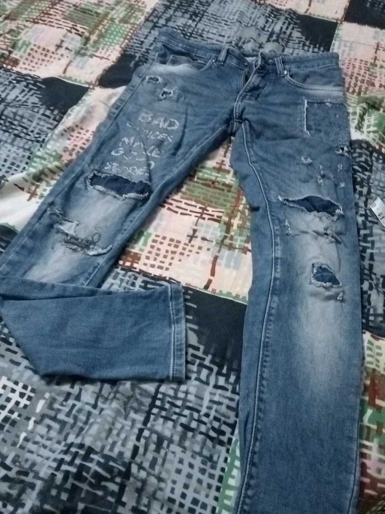 Distressed Blue Denim Jeans