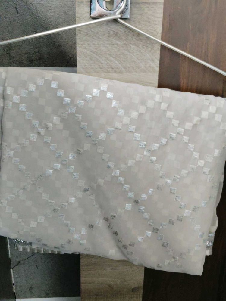 Elegant White Saree with Silver Motifs