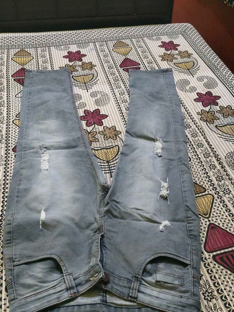Distressed Blue Denim Jeans
