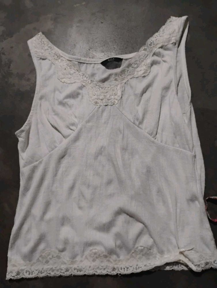 white hand stitched sleeves top