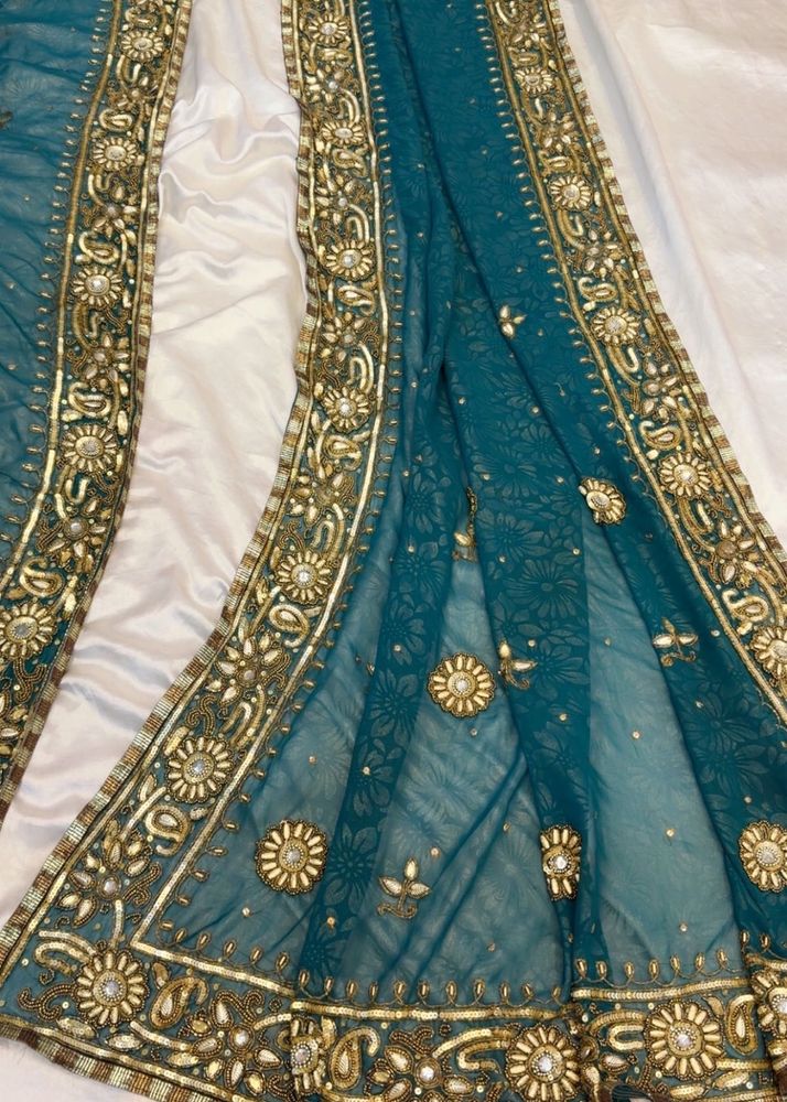 Exquisite Teal Embroidered Saree