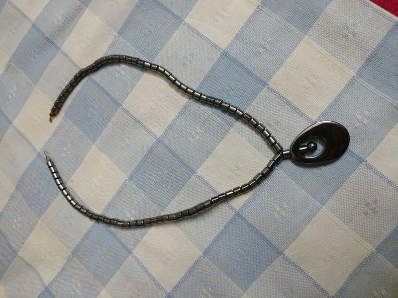 Gun metal neck piece