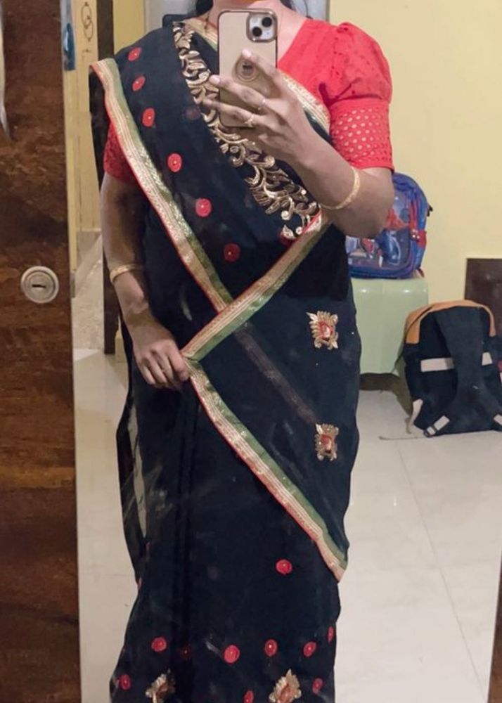 Elegant Black Saree with Red Embellishments