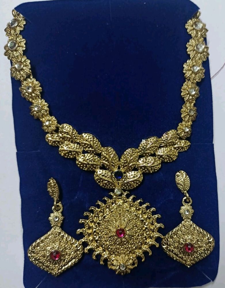 Golden Jewellery With Pink Stones