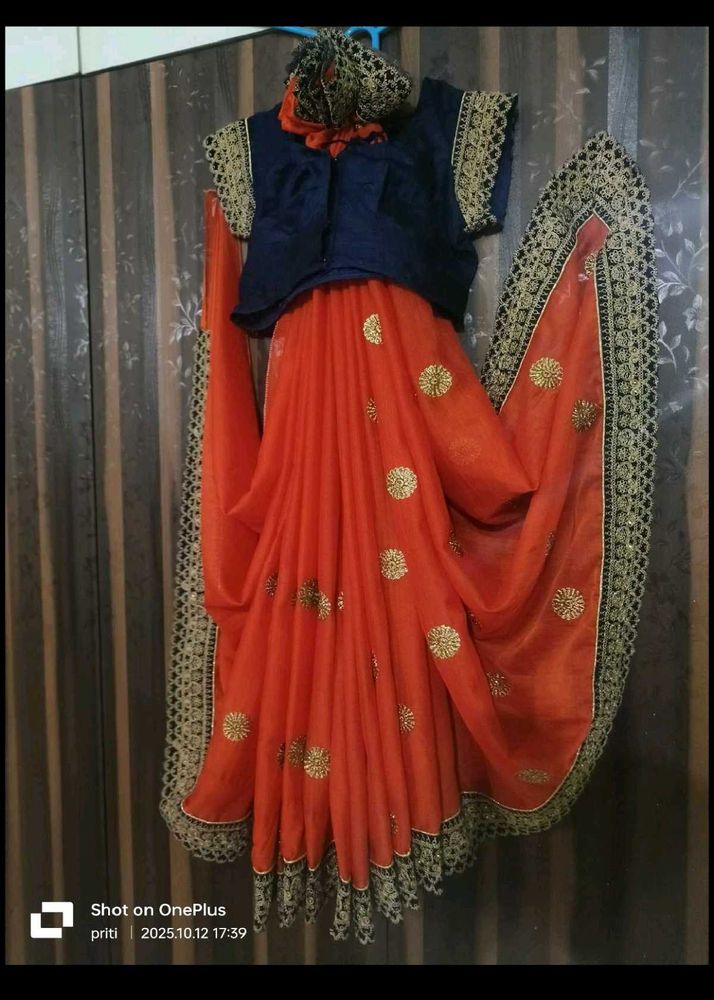 Orange Saree with Embellished Blouse