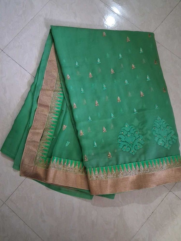 Elegant Green Saree with Golden Border