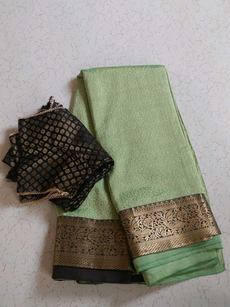 Elegant Light Green Saree with Black Blouse
