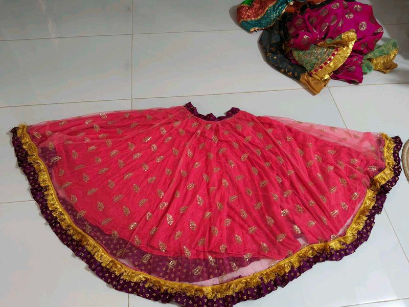 Beautiful Pink Net lehnga with Gold Embellishments