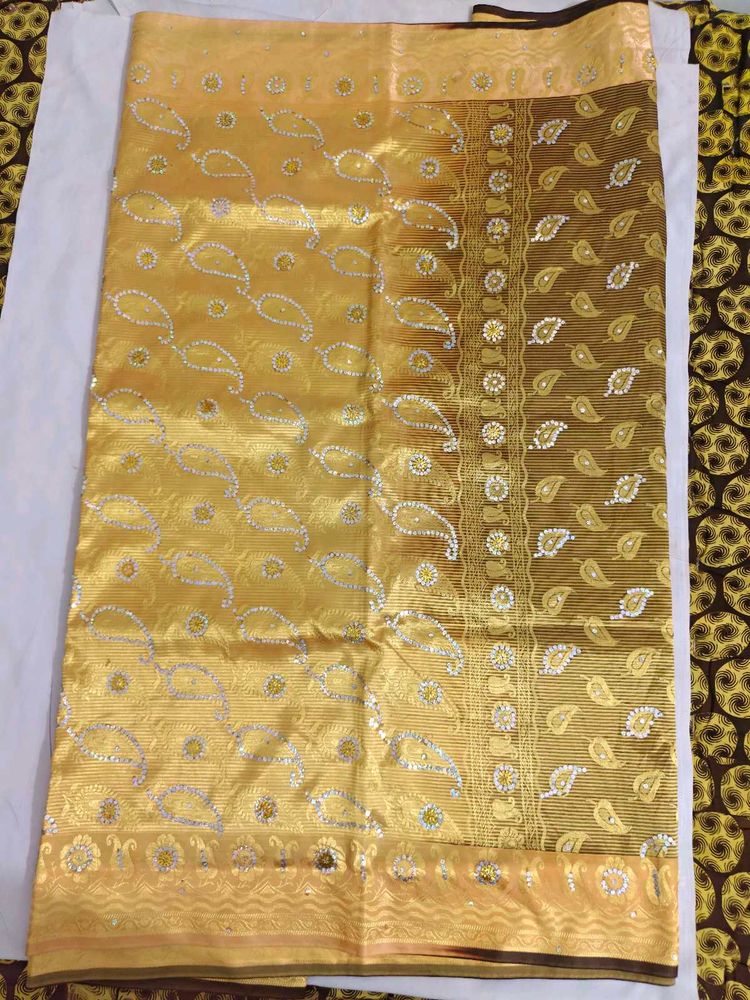Beautiful Golden Saree with Paisley Motifs