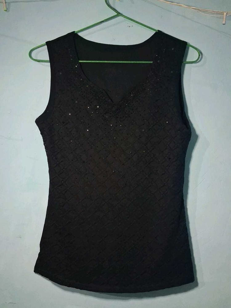 combo of Sleek Black Sleeveless Top and pink to