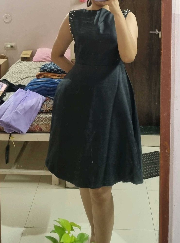 Elegant Black Dress with Pearl Accents