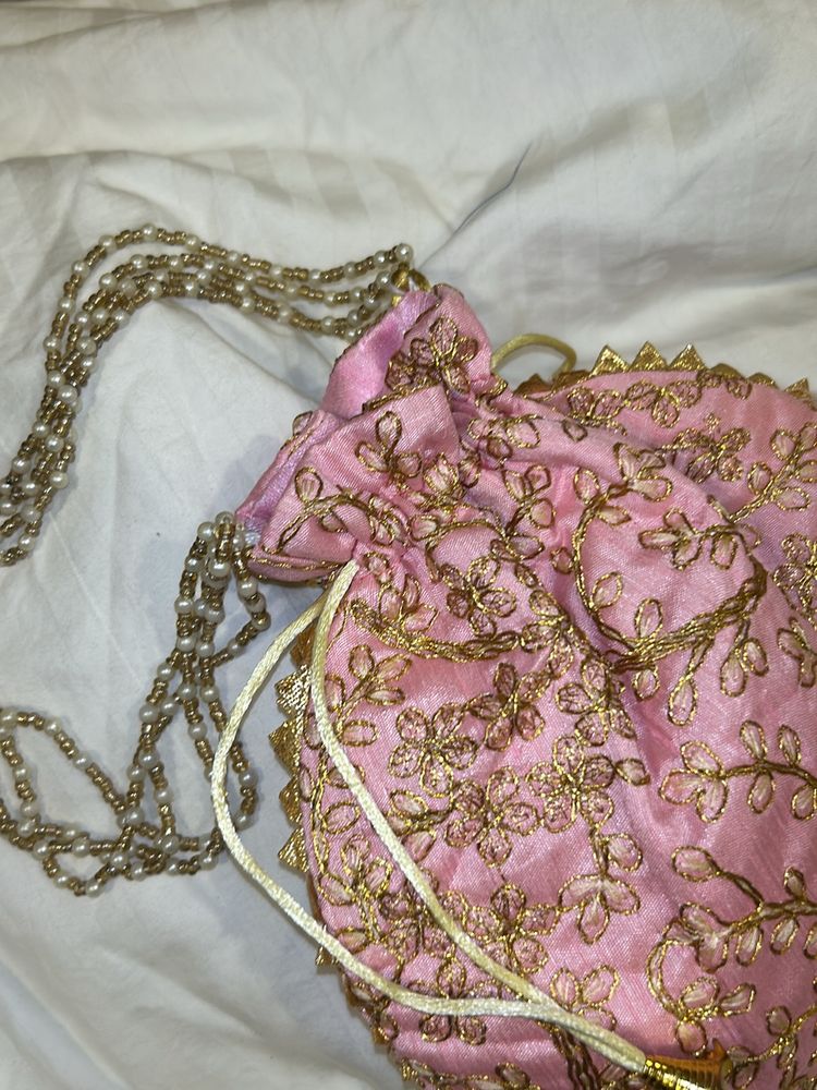 handmade Pink potli with gold embroidery