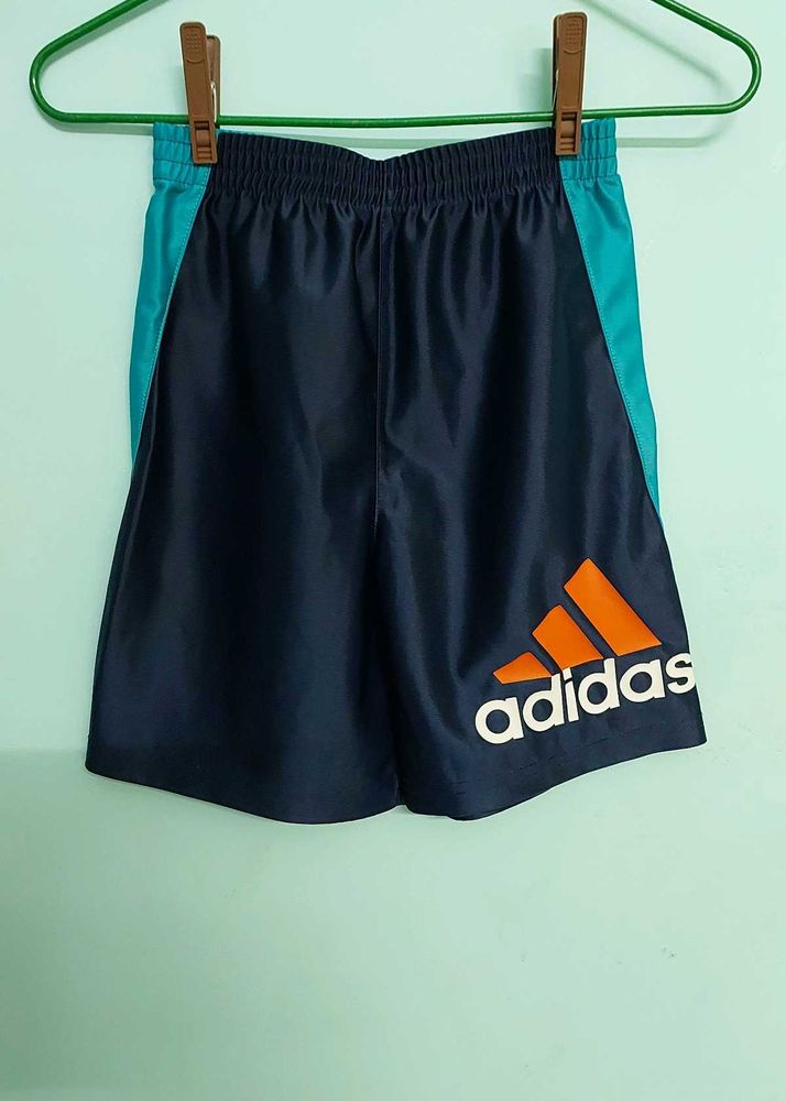 Navy blue and cyan Adidas shorts that combines spo