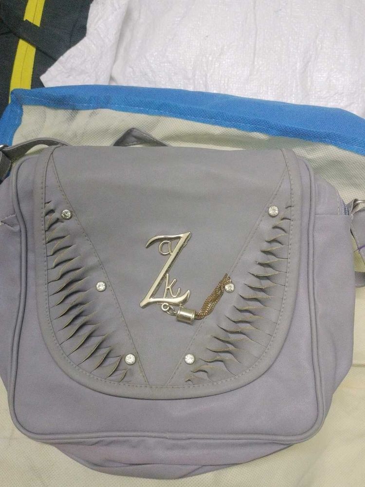 Stylish Grey Shoulder Bag with Embellishments