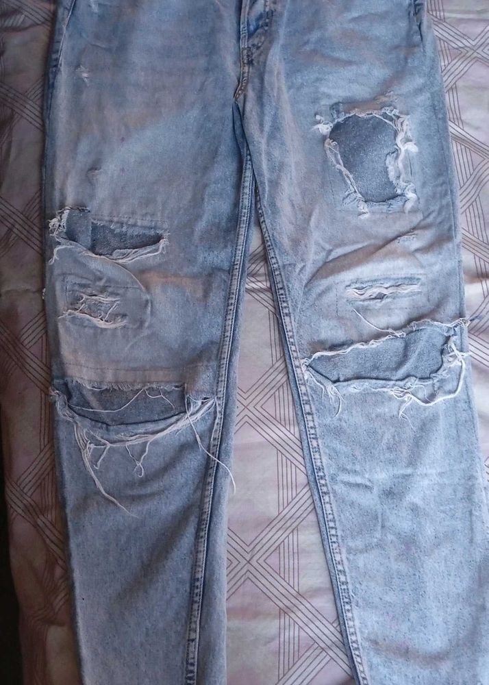Distressed Light Wash Denim Jeans
