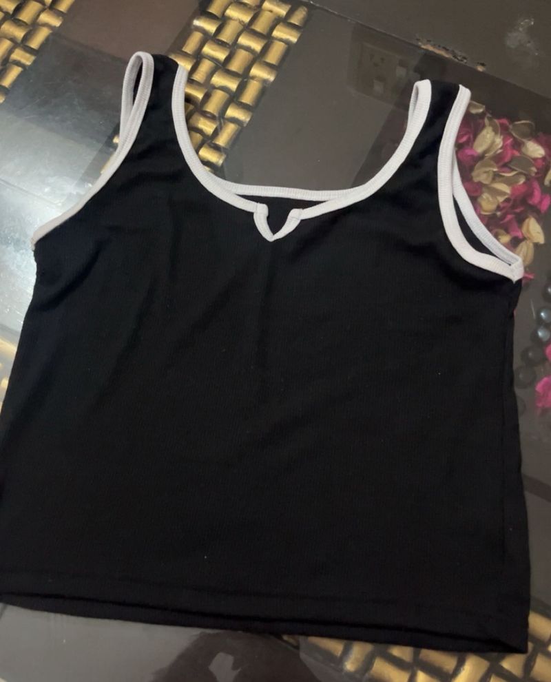 Sleek Black Tank Top with White Trim