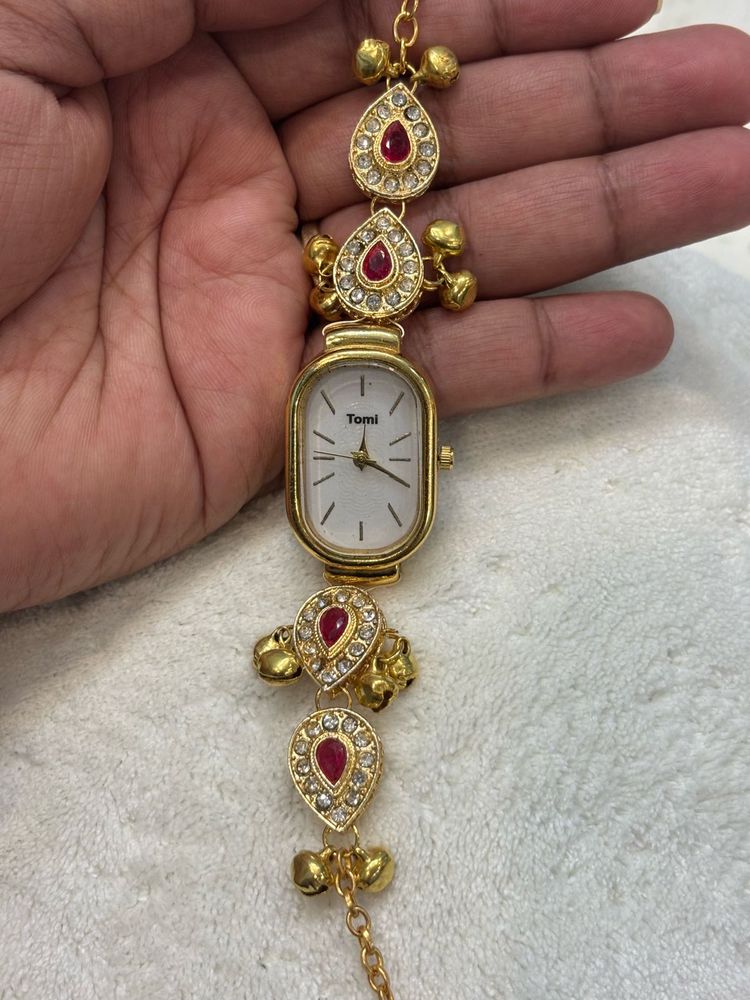 Elegant Gold Watch with Red &amp; Crystal Accents