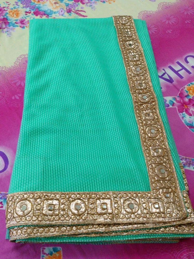 Elegant Teal Saree with Gold Border