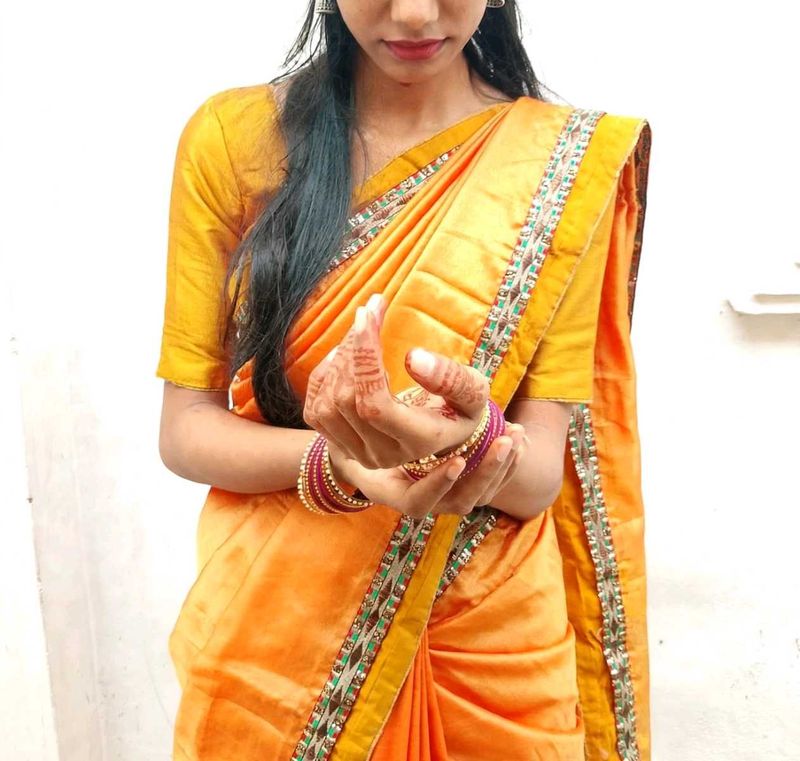 Vibrant Orange Silk Saree with Embellished Border