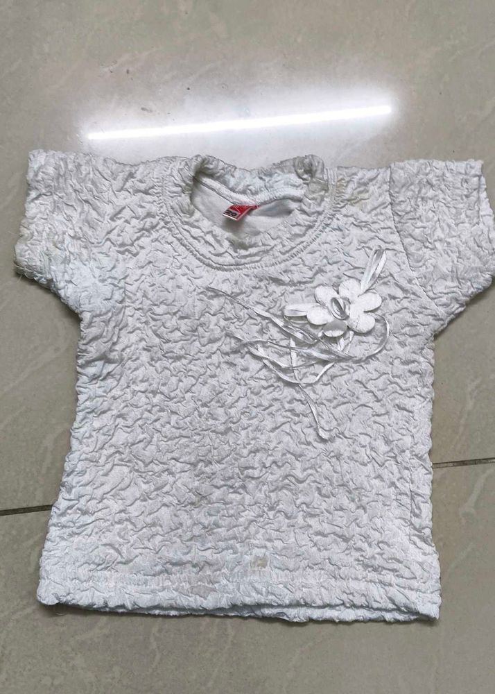 Cute White Textured Top with Flower Accent