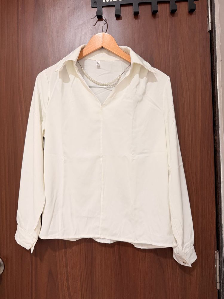 Elegant White Collared Blouse with Pearl Necklace