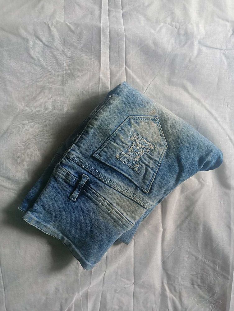 Distressed Blue Denim Jeans
