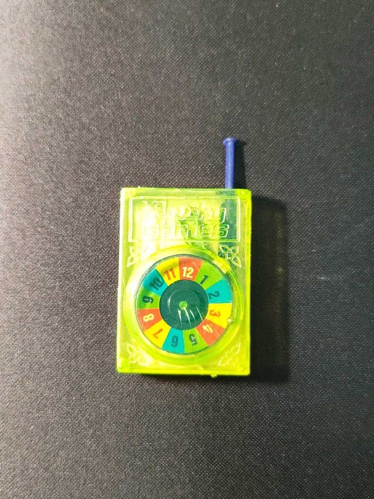 Vintage 90s Lucky spinner plastic toy