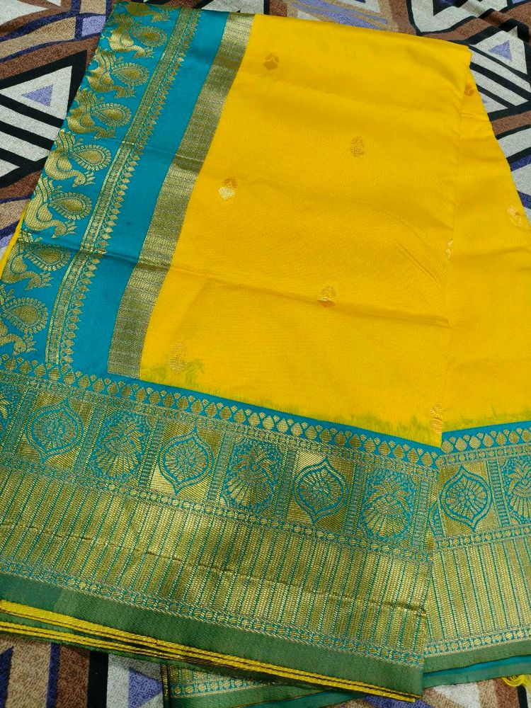 Elegant Yellow Silk Saree with Teal Border
