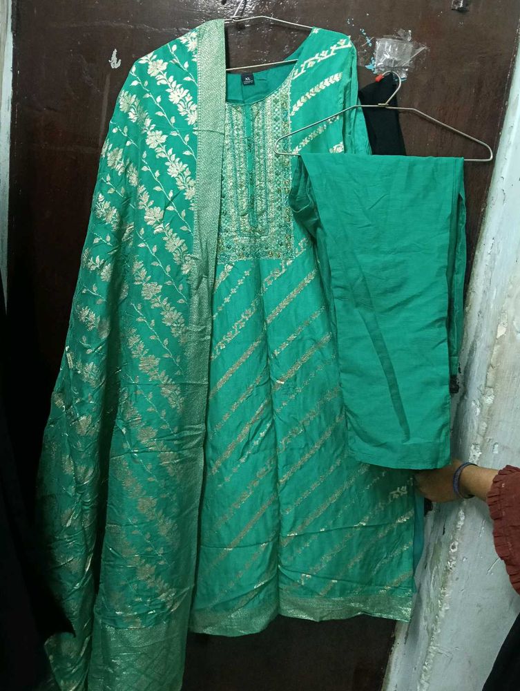 Elegant Green Saree with Gold Floral Print