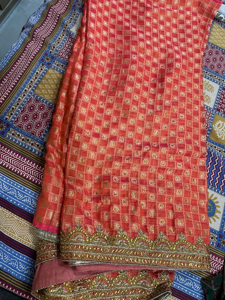 Beautiful Orange Saree with Gold Embellishments