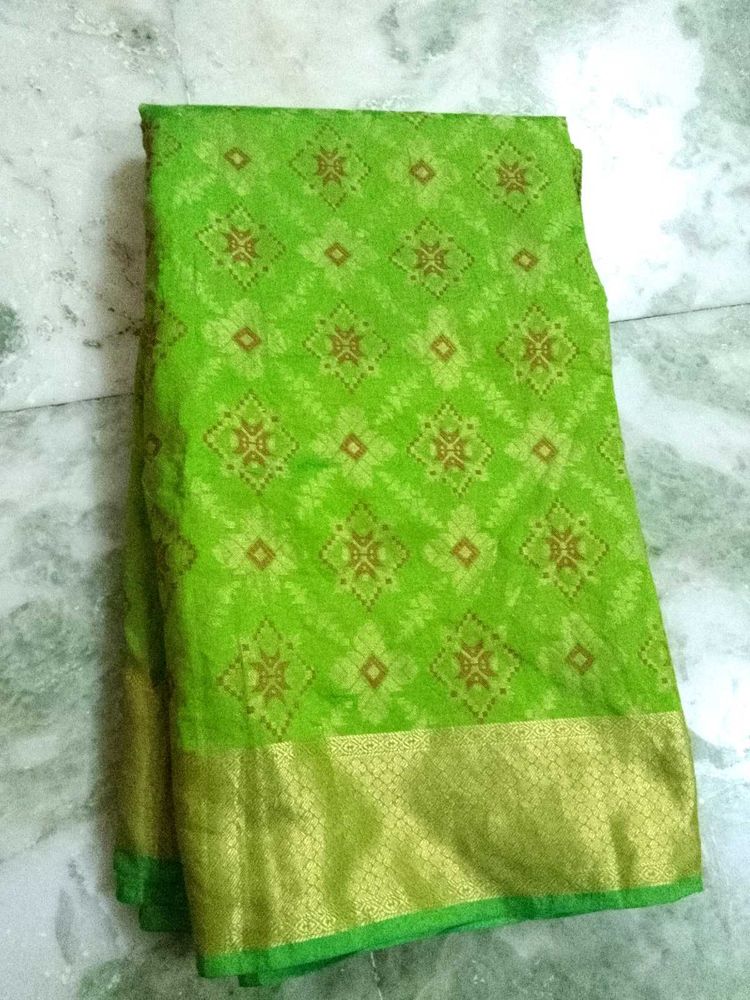 Vibrant Green Saree with Golden Border