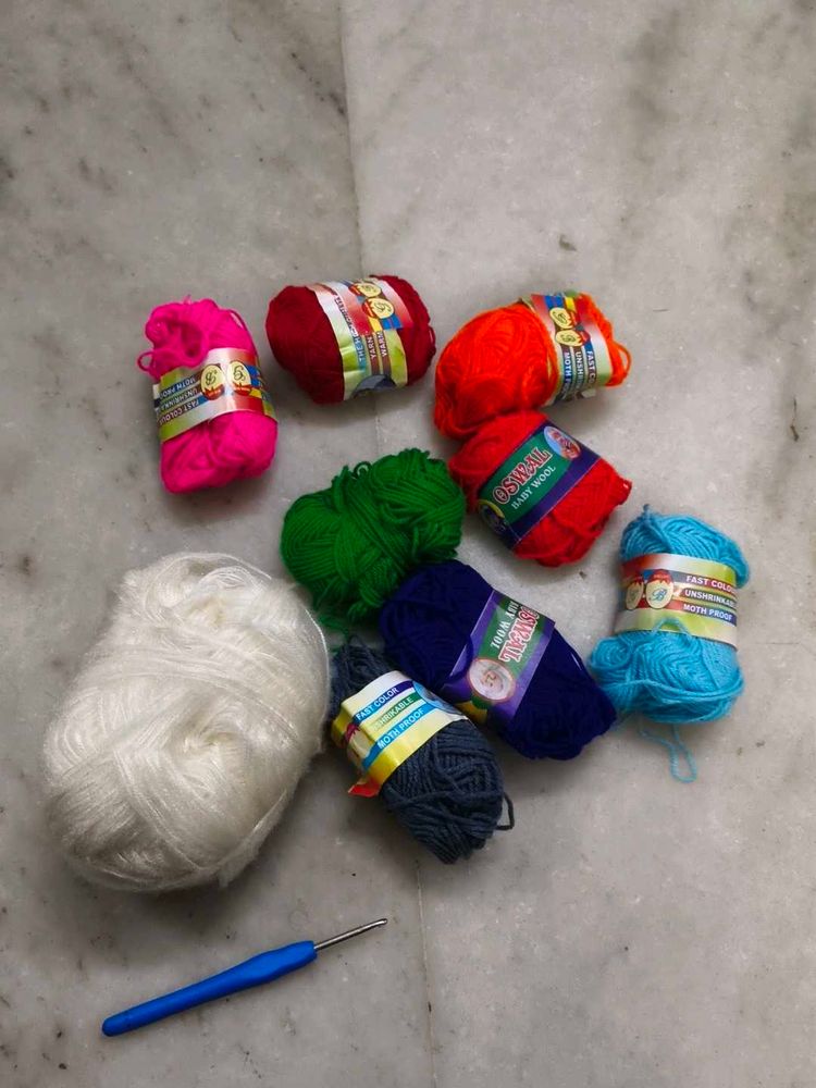 Assorted Yarn Balls and Crochet Hook