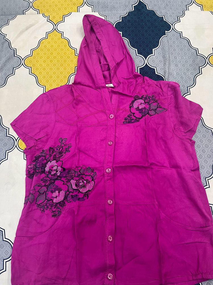 pink sleeveless shirt with cap