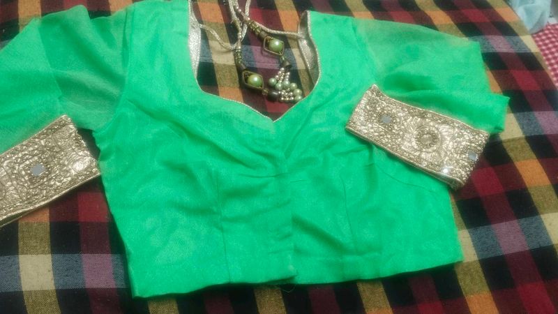 Vibrant Green Blouse with Golden Embellishments