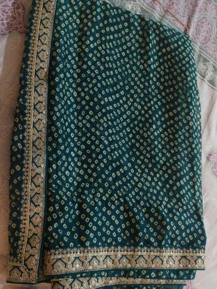 Beautiful Teal Saree with Golden Border