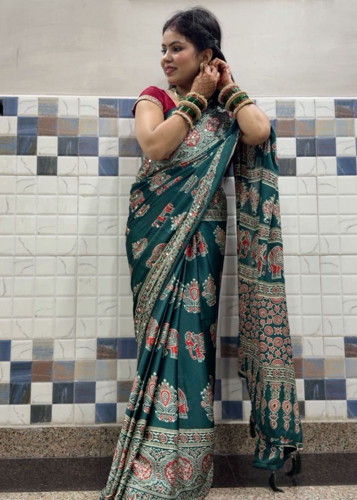 Elegant Teal Saree with Elephant Print