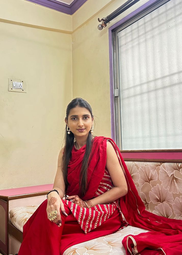Elegant Red Saree with Embellishments