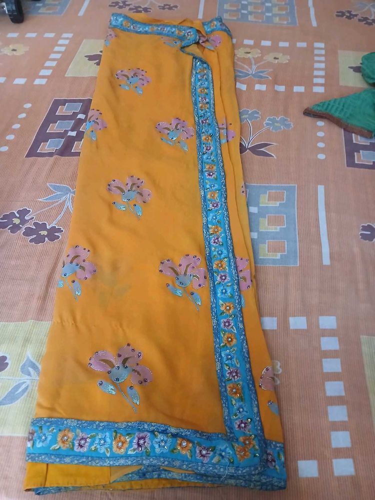 Beautiful Orange Saree with Floral Print