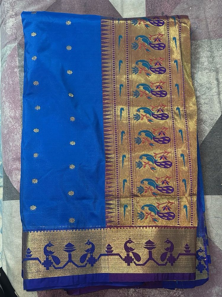 Vibrant Blue Silk Saree with Peacock Motif