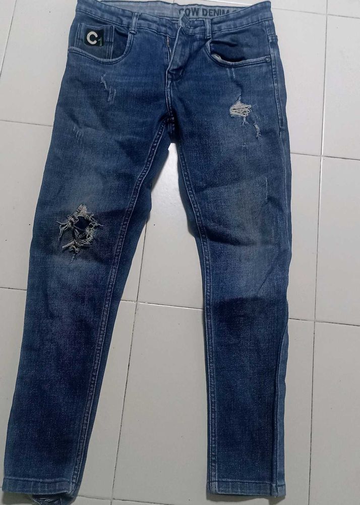 Distressed Blue Denim Jeans